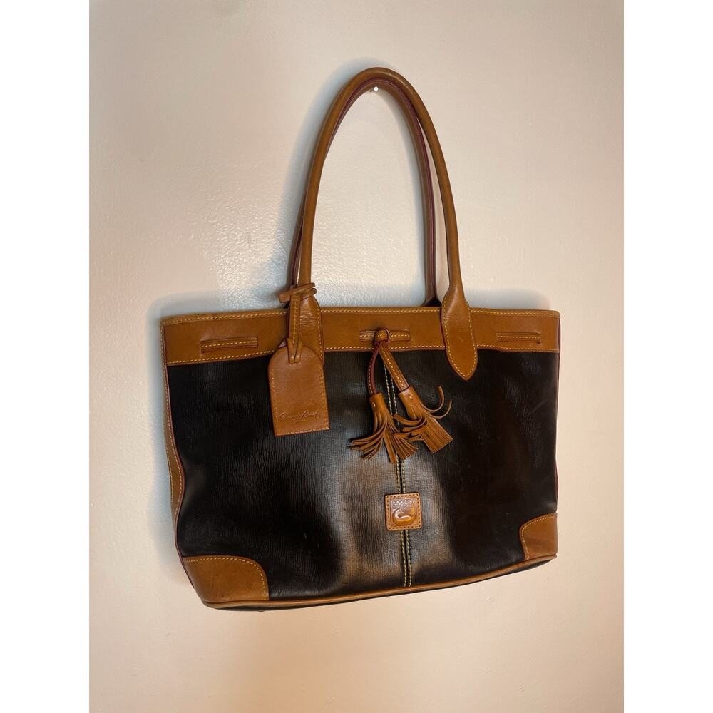 Dooney & Bourke Black Saffiano Tassel Bucket Tote bag in black with tan trim
